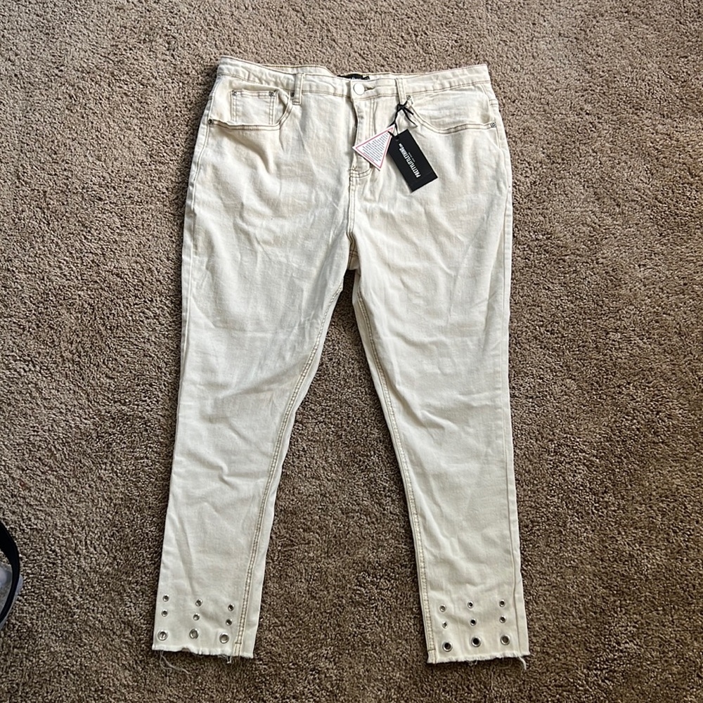 Distressed white jeans
